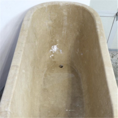 Yellow travertine bath tub 